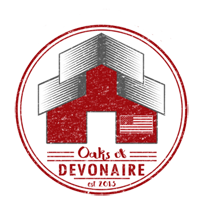 A red and white logo of the town of devonaire.